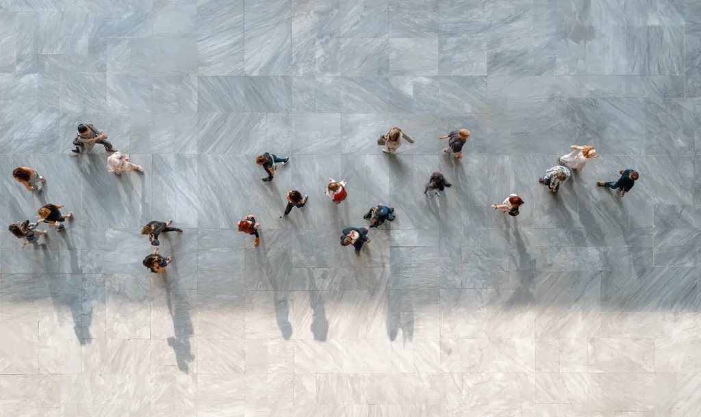 UX UI Design showing many people walking across the pavement, implying a strategy fro Totally Digital is required